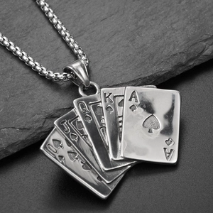 Macro shot of stainless steel royal flush poker card pendant on a square box chain