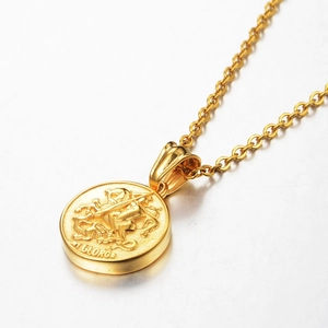 Detailed close-up of gold St. George coin pendant with polished mirror finish on cross chain