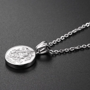 Macro view of St. George Dragon Slayer relief coin pendant with classic silver O-chain