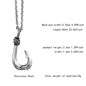Detail view of silver fish hook pendant in stainless steel with wavy texture