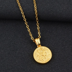 Close-up of golden O-chain necklace featuring a detailed St. George dragon slayer medal