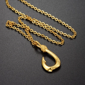 Golden fish hook pendant necklace with intricate carvings and elegant O-shaped chain link
