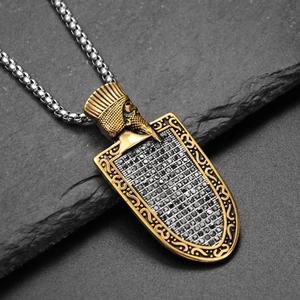Detail of vintage shield pendant with engraved head relief and black pave-set zircon stones