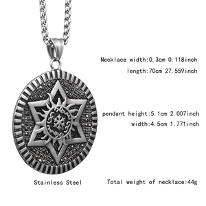 Detailed view of stainless steel medallion necklace with star and sun embossed pattern
