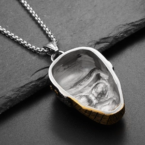 Macro shot of industrial gothic ninja mask pendant back detail with a silver box chain
