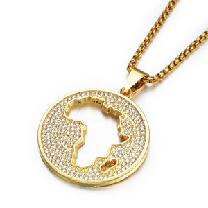 Detail of gold-plated pendant necklace featuring hollow Africa map design with crystals
