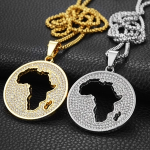 Detailed close-up of hollow Africa map pendant necklaces with rhinestones and rope chains