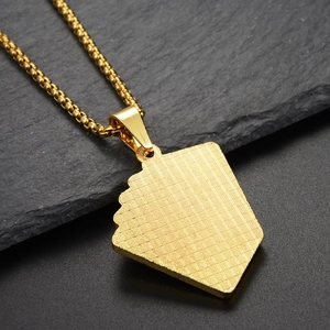 Detailed close-up of the textured grid pattern on the gold pendant's reverse side