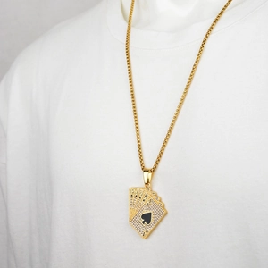 Hip hop gold royal flush pendant necklace with sparkling crystals on a model outfit