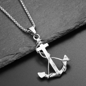 Detail shot of a polished anchor pendant with rope texture on a square bead chain