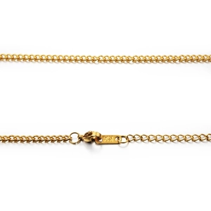 Detail of gold titanium steel necklace showing lobster clasp and K14 hallmark engraving