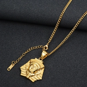 Detailed close-up of golden Egyptian Pharaoh pendant with K14 engraving and lobster clasp