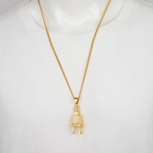 Hip hop style gold plug pendant necklace with white crystals on a detailed metal chain