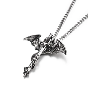 Macro detail of vintage silver dragon wrapped around long sword pendant on link chain
