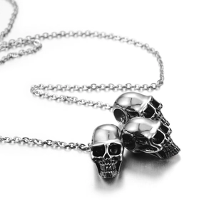 Hip-hop style stainless steel necklace featuring three realistic polished skull pendants