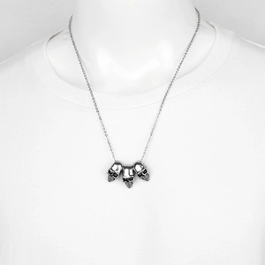 Gothic hip hop titanium steel necklace featuring a triple skull pendant for men and women