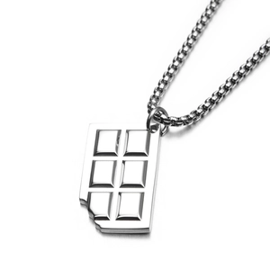 Macro shot of silver chocolate bar pendant in titanium steel with a sleek bead chain