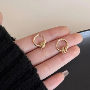 Elegant 18K gold-plated hoop earrings featuring three small zircon-encrusted rings