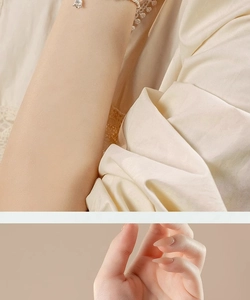 Detail of silver lily of the valley bracelet with jade beads on model's wrist