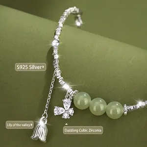 S925 silver bracelet featuring green nephrite jade beads lily of the valley and butterfly