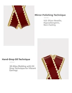 Detailed macro view of French vintage gold C-shape earrings with red enamel and 925 silver pins