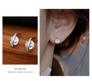 Detail of S925 silver stud earrings with zircon stones and model wearing display