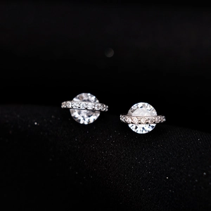 Elegant silver saturn planet stud earrings with sparkling cubic zirconia stones