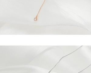 Detailed comparison of rose gold and silver tassel necklaces with cubic zirconia pendants