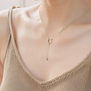 Elegant gold Y-shaped tassel necklace for women featuring a sparkling zircon circle pendant