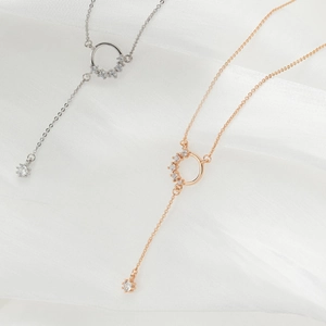 Elegant Y-shaped tassel necklace in silver and rose gold finishes with CZ accents
