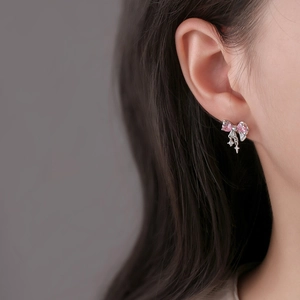 Elegant silver bow earrings with pink heart gemstones and small star pendants
