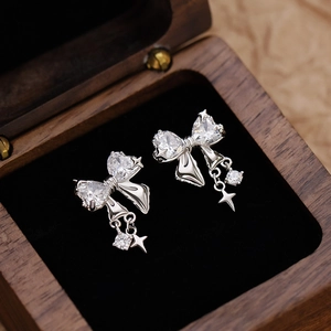 Elegant silver bow stud earrings with heart-shaped zircon stones and star drop pendants