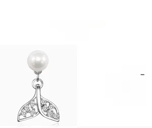 Detail view of pearl fishtail earrings with sparkling cubic zirconia in silver finish