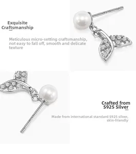 Close-up of S925 silver fishtail earrings with micro-pave zircons and white pearls