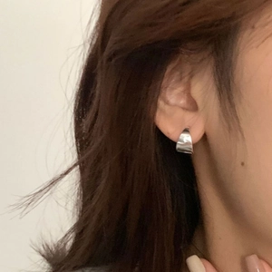Minimalist silver geometric wide huggie hoop earrings with smooth polished finish