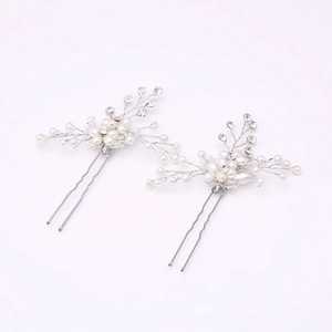 Handmade bridal hair pins set with white pearls and sparkling crystals in silver finish