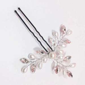 Detail of handmade bridal hair pin with pearls, crystals and silver wire weaving