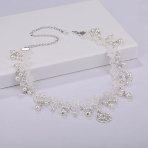 Elegant white lace choker necklace with pearl accents and a snowflake crystal pendant