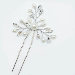 Detail of bridal hair pin with silver wire, white pearls and sparkling marquise crystals