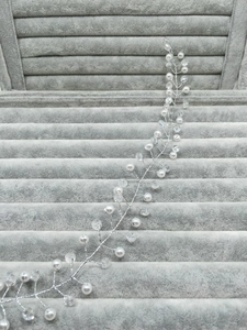 Detail of handmade silver bridal headband with pearls and sparkling crystal beads