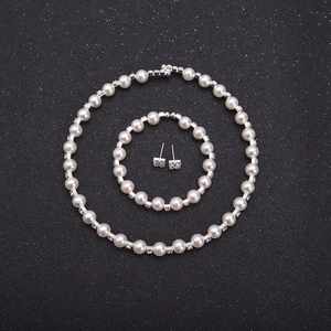 Detailed set of 8mm pearl and rhinestone bridal necklace, bracelet and stud earrings set