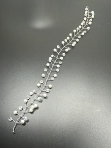 Detail of silver wedding hair vine with white pearls and sparkling crystal beads