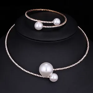Rose gold bridal jewelry set with pearls and rhinestones featuring choker and bracelet