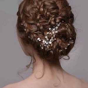 Elegant bridal hair vine with white pearls and crystals on a woven silver wire base