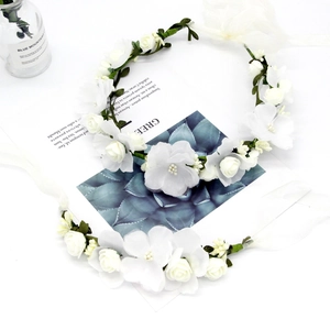 Elegant white floral crown set with roses and ribbons for weddings and photography