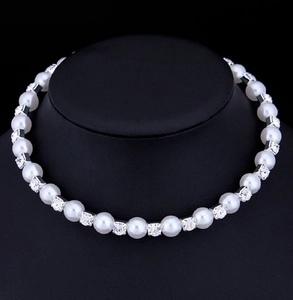 Detailed macro view of an 8mm bridal pearl and rhinestone crystal choker necklace