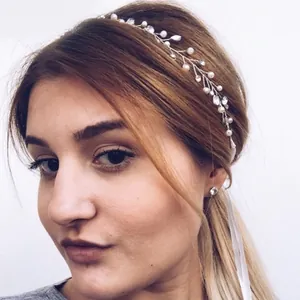 Silver bridal hair vine with pearls and rhinestones on model with white ribbon tie