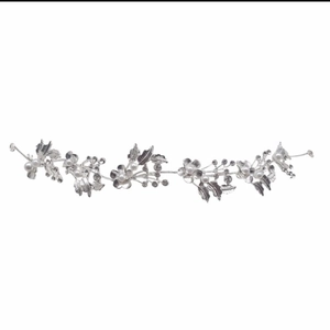Silver bridal headband with intricate crystal leaves and pearls on a white background