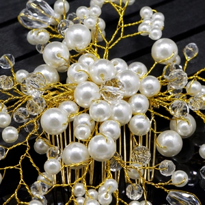 Detailed close-up of handmade bridal hair comb with pearls, crystals and gold wire work