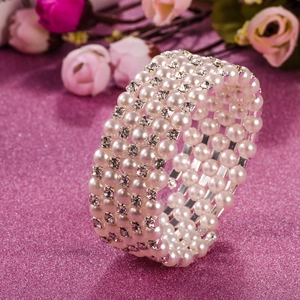 Close-up of four-row pearl and rhinestone stretch bracelet for bridal wedding jewelry